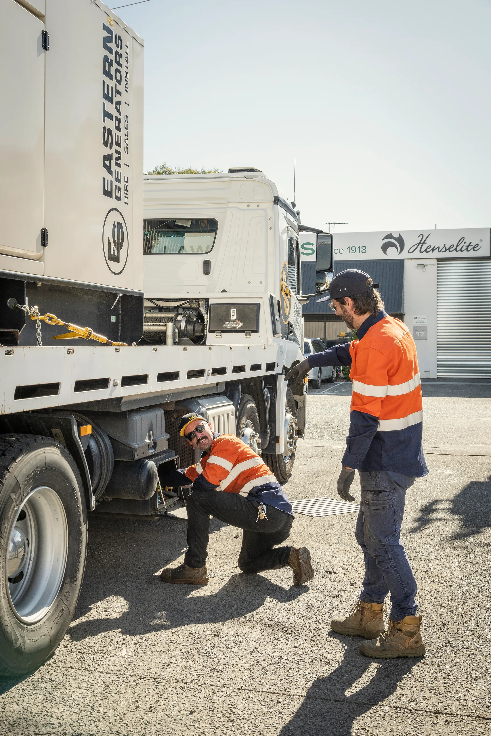 An Eastern Generators crew unloading a generator from the truck on site