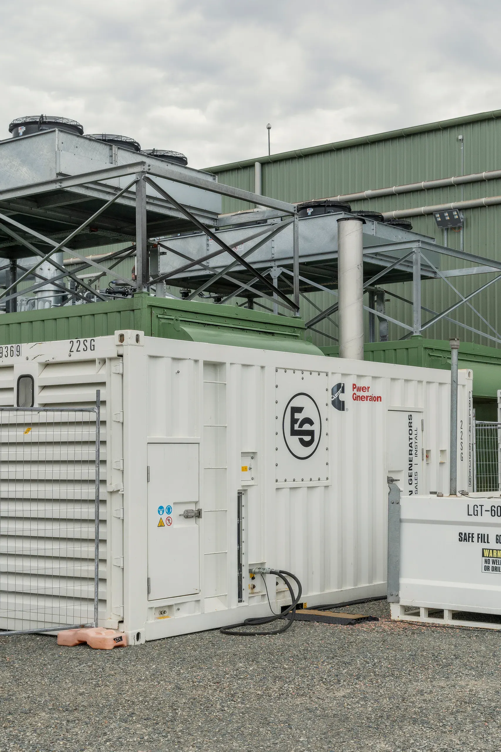 A containerised power generation unit installed on an industrial site