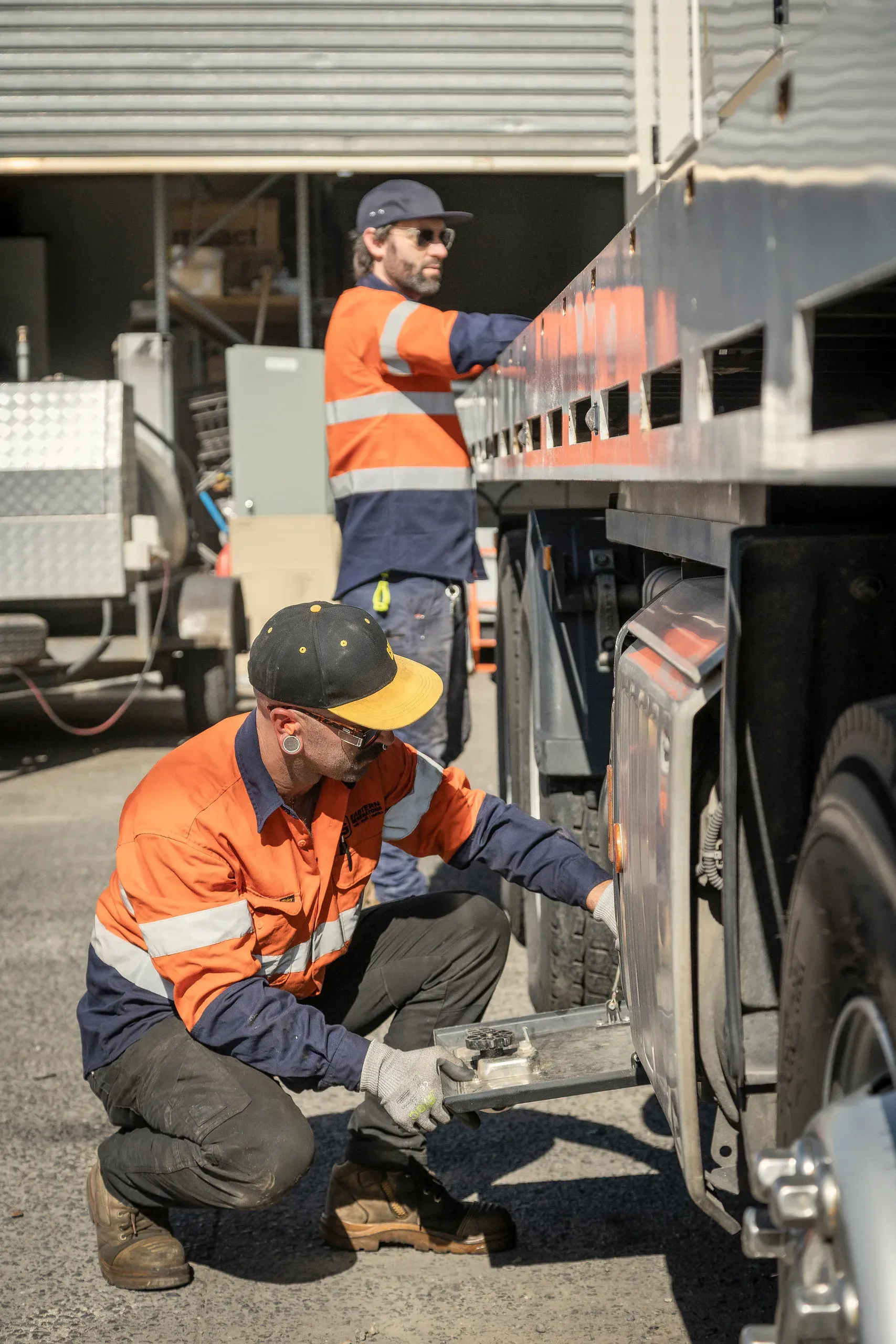 Eastern Generators crew working at the tail of a transport truck
