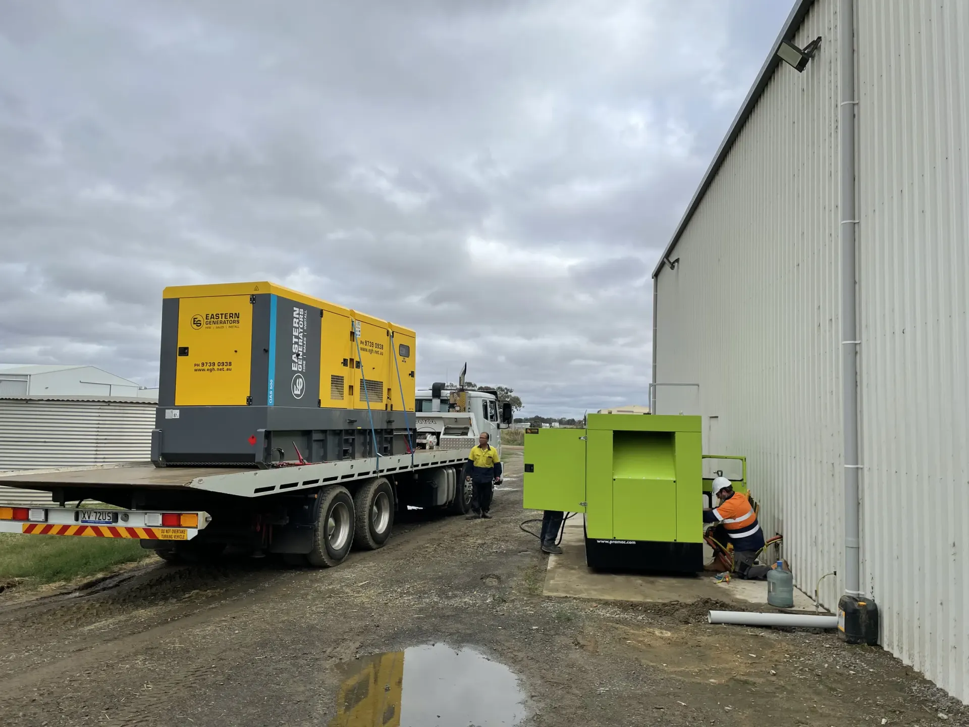 A large hire generator being carried on a semi trailer