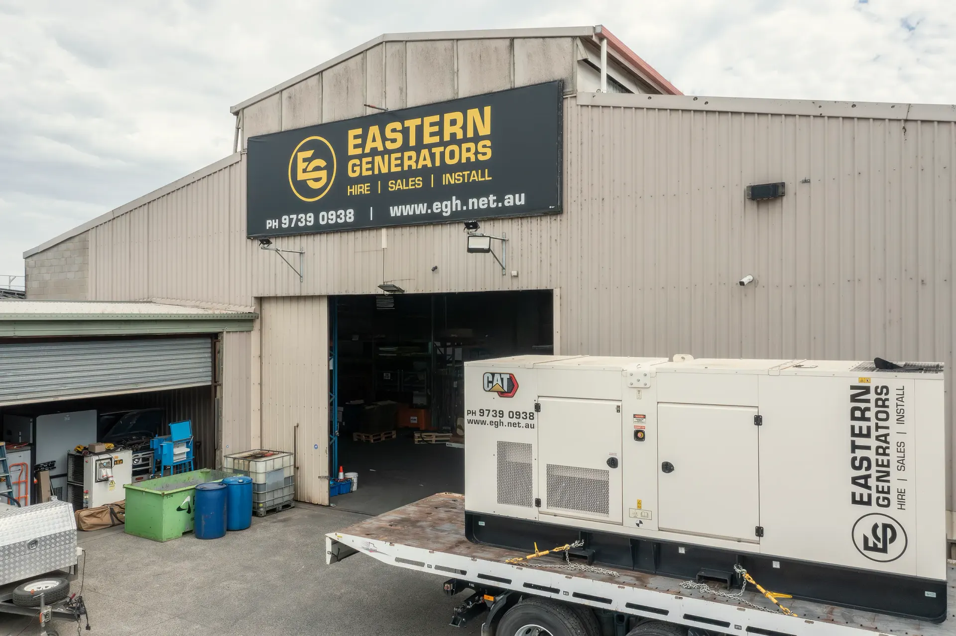 A canopied Caterpillar generator on a trailer outside the Eastern Generators depot in Kilsyth